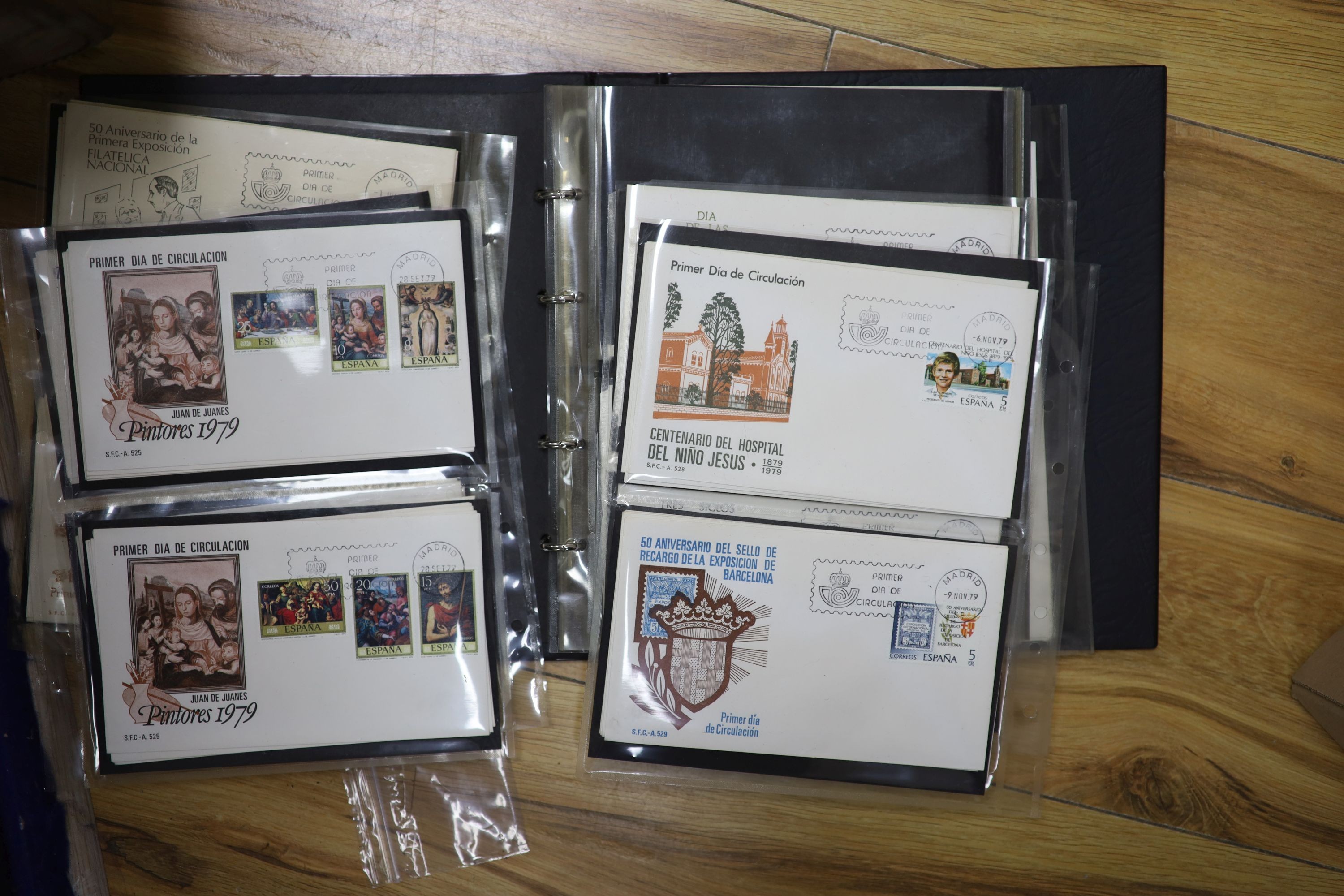 A collection of stamps and coins, including first day covers